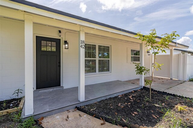 1842 Puritan Ave, Winter Park, FL 32792 - property entrance with covered porch and concrete block siding