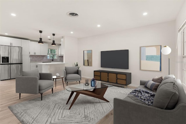 1842 Puritan Ave, Winter Park, FL 32792 - living area featuring recessed lighting, light wood-style floors, and baseboards