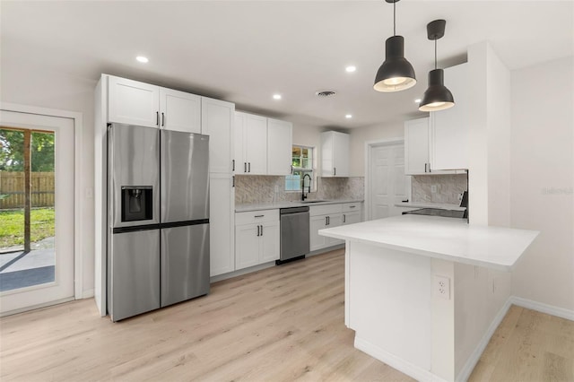 1842 Puritan Ave, Winter Park, FL 32792 - kitchen with appliances with stainless steel finishes, a sink, white cabinetry, and recessed lighting