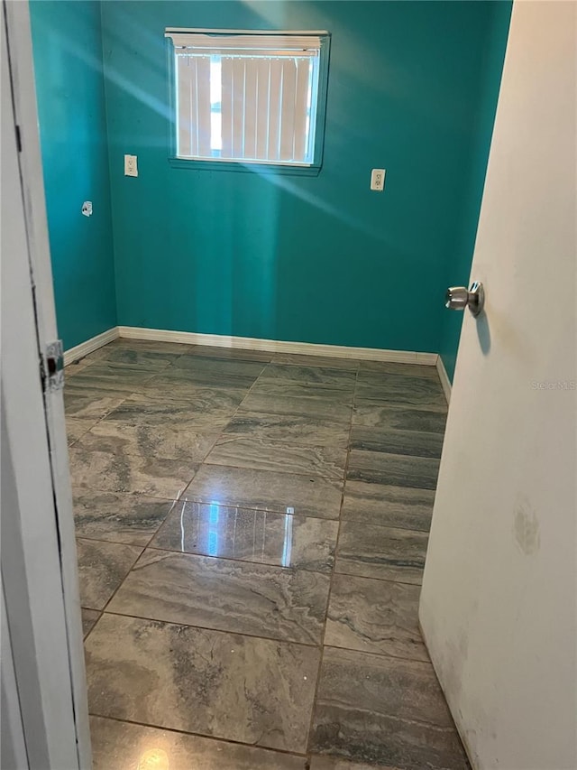 1009 Kenmore Dr, Brandon, FL 33510 - spare room featuring baseboards