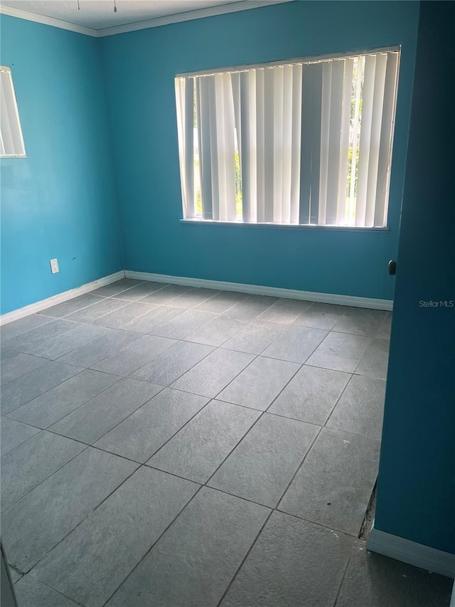 1009 Kenmore Dr, Brandon, FL 33510 - unfurnished room featuring healthy amount of natural light, ornamental molding, and baseboards
