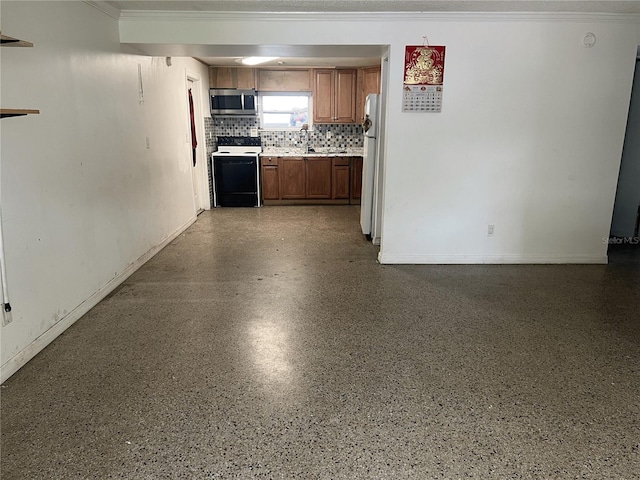 1009 Kenmore Dr, Brandon, FL 33510 - kitchen featuring electric range, stainless steel microwave, light countertops, tasteful backsplash, and crown molding