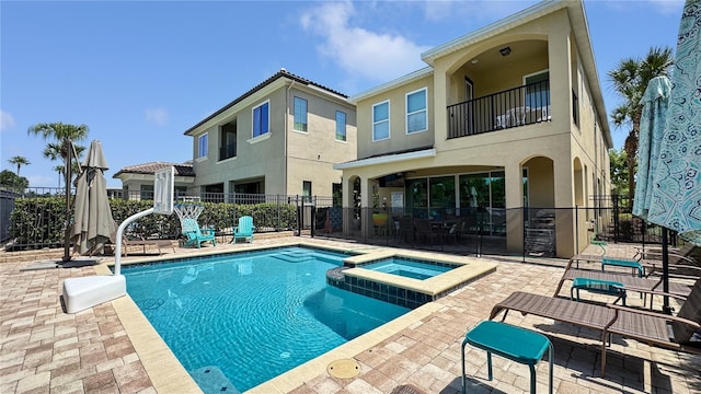 1228 Castle Pines Ct, Reunion, FL 34747 - view of swimming pool with a patio and a pool with connected hot tub