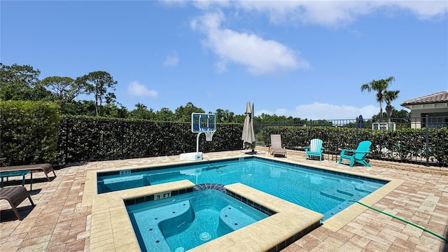 1228 Castle Pines Ct, Reunion, FL 34747 - view of pool with a patio and a pool with connected hot tub