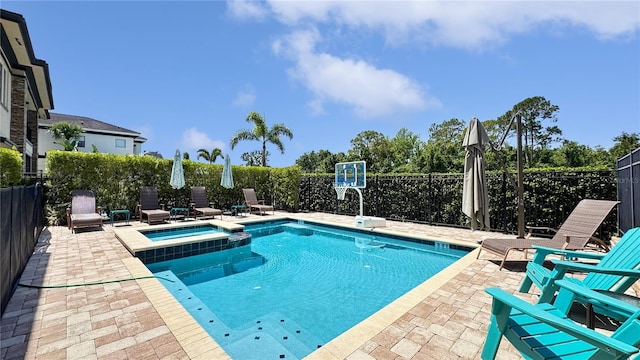 1228 Castle Pines Ct, Reunion, FL 34747 - view of pool featuring a patio, a pool with connected hot tub, and a fenced backyard