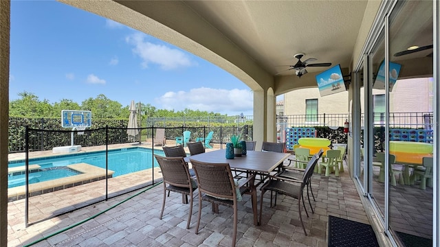 1228 Castle Pines Ct, Reunion, FL 34747 - view of patio / terrace featuring a ceiling fan, a pool with connected hot tub, and outdoor dining space