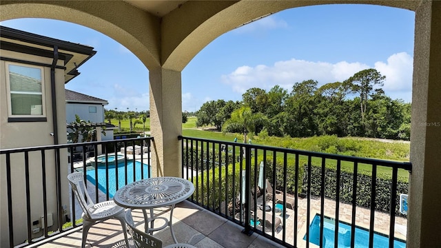 1228 Castle Pines Ct, Reunion, FL 34747 - balcony with view of pool and a pool with connected hot tub