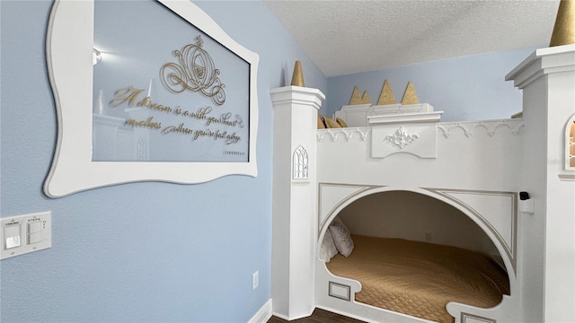 1228 Castle Pines Ct, Reunion, FL 34747 - laundry room featuring a textured ceiling and wood finished floors