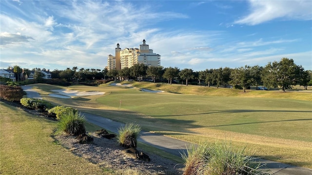 1228 Castle Pines Ct, Reunion, FL 34747 - view of community with view of golf course and a yard