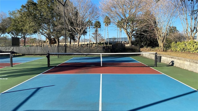 1228 Castle Pines Ct, Reunion, FL 34747 - view of tennis court featuring community basketball court