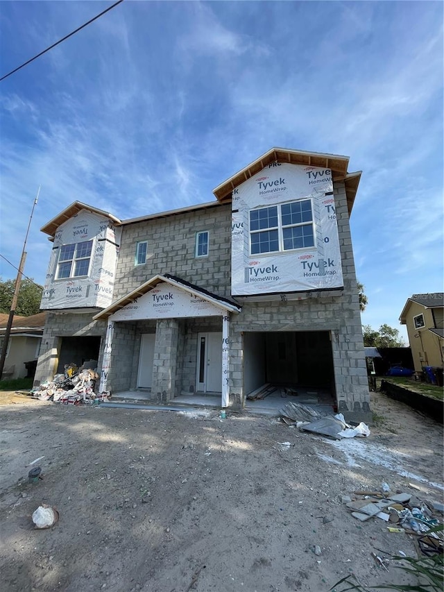 1308 Verona St Unit 1308 & 1310, Kissimmee, FL 34741 - unfinished property with an attached garage and stone siding