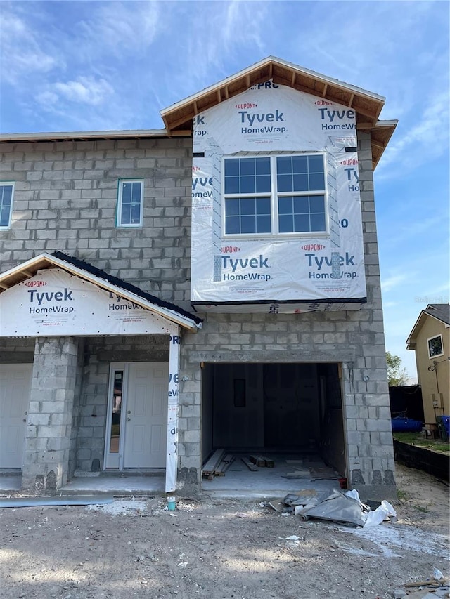 1308 Verona St Unit 1308 & 1310, Kissimmee, FL 34741 - view of building exterior with a garage