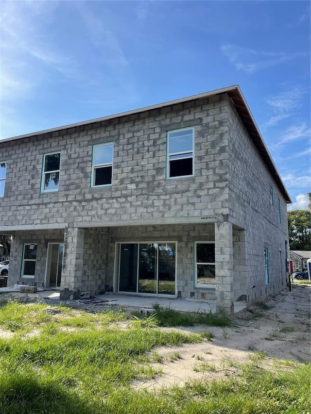1308 Verona St Unit 1308 & 1310, Kissimmee, FL 34741 - rear view of house with stone siding