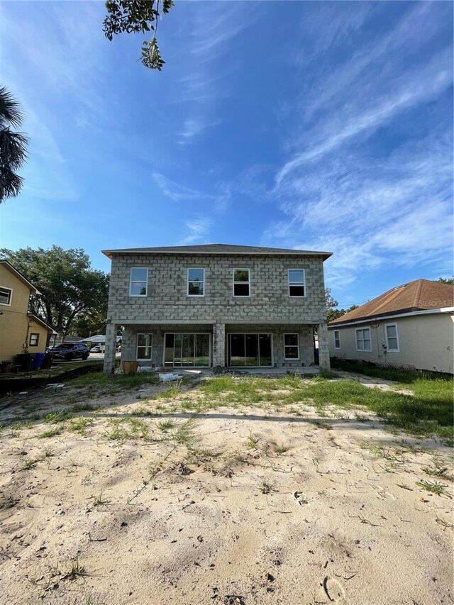 1308 Verona St Unit 1308 & 1310, Kissimmee, FL 34741 - back of property featuring stone siding