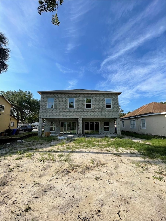 1308 Verona St Unit 1308 & 1310, Kissimmee, FL 34741 - rear view of property with stone siding