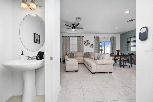 1113 Merrill St, Davenport, FL 33837 - living room featuring light tile patterned flooring, ceiling fan, recessed lighting, and baseboards