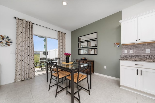1113 Merrill St, Davenport, FL 33837 - dining space with baseboards and light tile patterned flooring