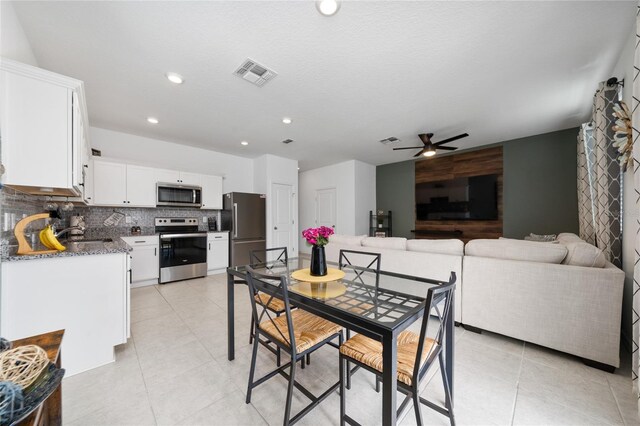 1113 Merrill St, Davenport, FL 33837 - dining space featuring ceiling fan, light tile patterned floors, and recessed lighting