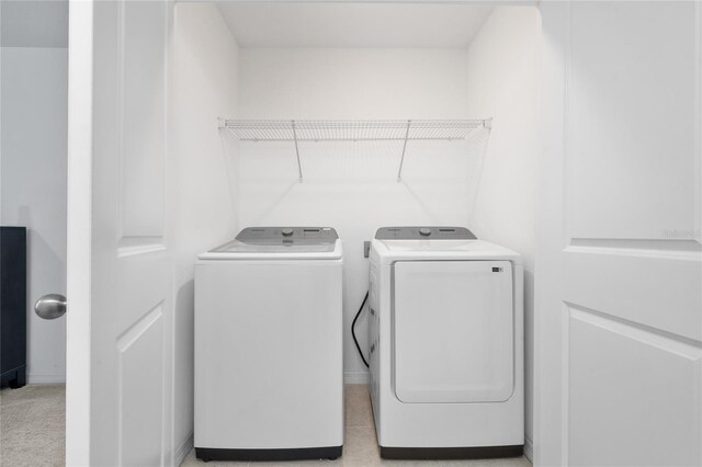 1113 Merrill St, Davenport, FL 33837 - laundry room featuring washer and dryer and baseboards
