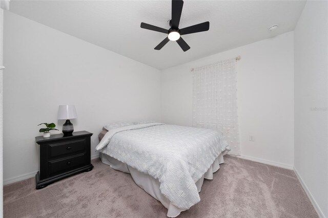 1113 Merrill St, Davenport, FL 33837 - carpeted bedroom with baseboards and ceiling fan