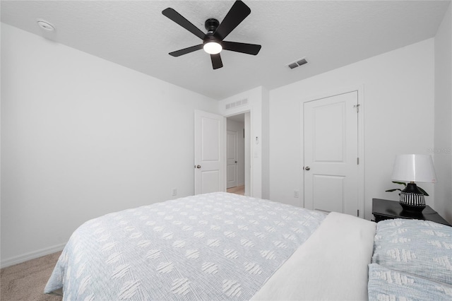 1113 Merrill St, Davenport, FL 33837 - bedroom with light colored carpet, baseboards, and ceiling fan