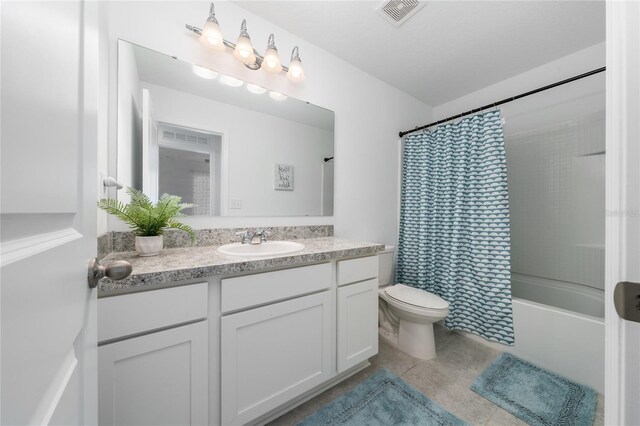 1113 Merrill St, Davenport, FL 33837 - bathroom with vanity, toilet, tile patterned flooring, and shower / bath combo with shower curtain