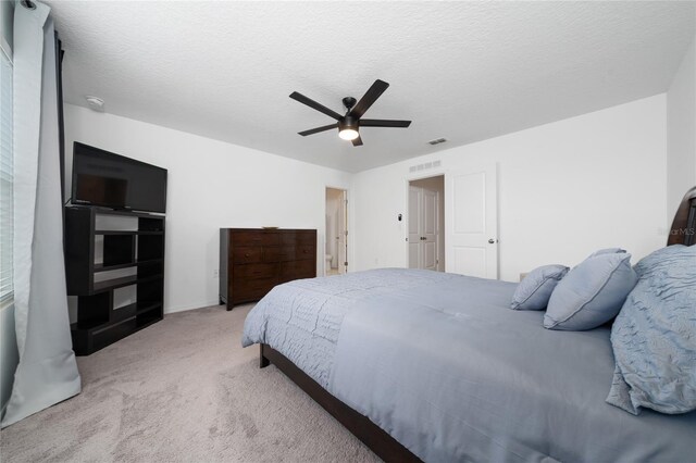 1113 Merrill St, Davenport, FL 33837 - carpeted bedroom with ceiling fan and a textured ceiling