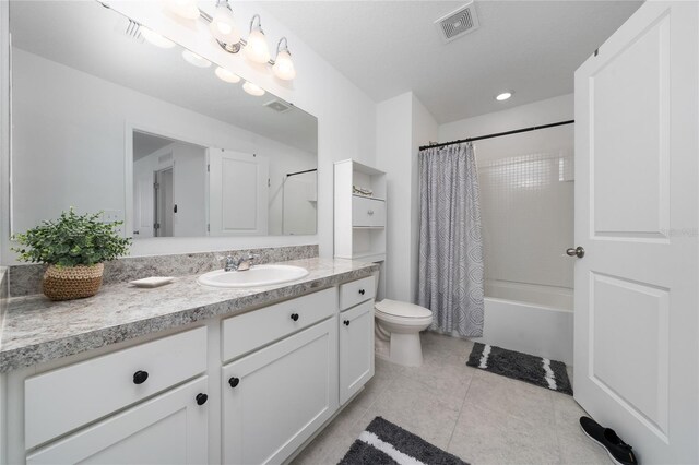 1113 Merrill St, Davenport, FL 33837 - full bathroom featuring vanity, toilet, shower / tub combo, and tile patterned flooring