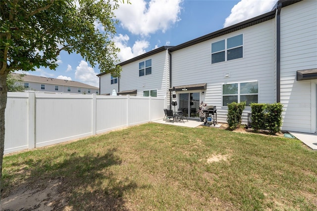1113 Merrill St, Davenport, FL 33837 - rear view of property with a patio