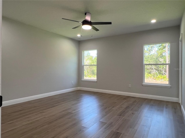 814 Gator Ln, Deltona, FL 32738 - empty room featuring dark wood-type flooring, a ceiling fan, baseboards, and recessed lighting