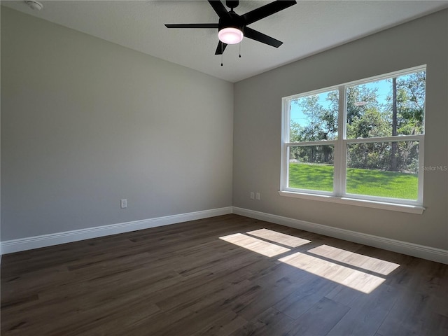 814 Gator Ln, Deltona, FL 32738 - unfurnished room featuring baseboards, healthy amount of natural light, dark wood-style flooring, and ceiling fan