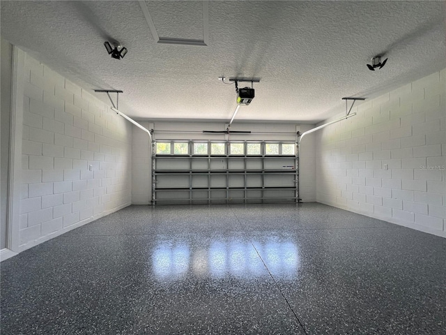 814 Gator Ln, Deltona, FL 32738 - garage featuring a garage door opener and concrete block wall