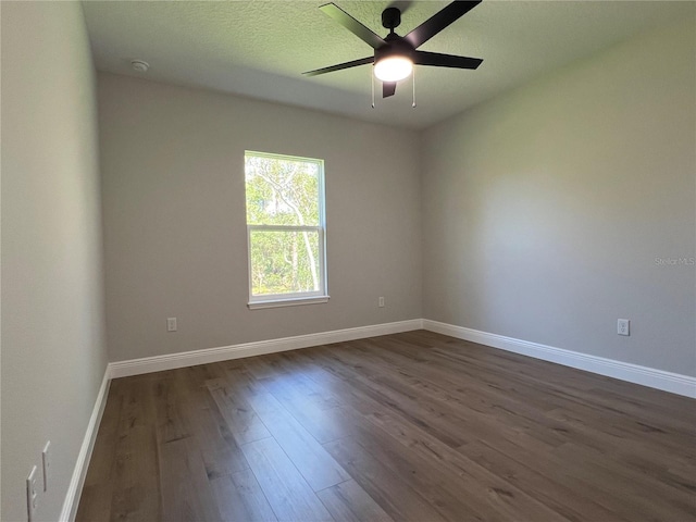 814 Gator Ln, Deltona, FL 32738 - empty room featuring dark wood-style flooring, ceiling fan, baseboards, and a smoke detector