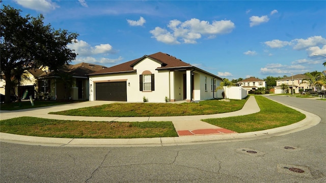 1025 Belvoir Dr, Kissimmee, FL 34744 - single story home with stucco siding, concrete driveway, a garage, and a front yard