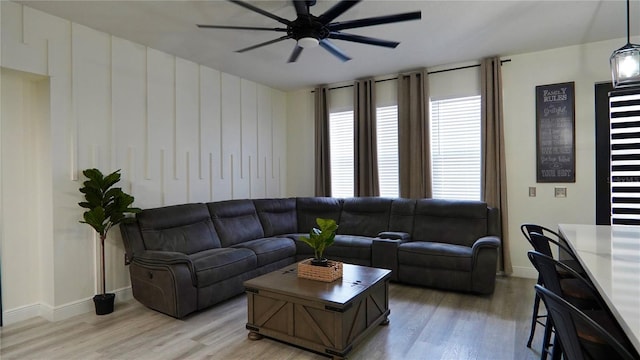 1025 Belvoir Dr, Kissimmee, FL 34744 - living area featuring ceiling fan, light wood finished floors, and baseboards