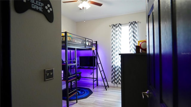 1025 Belvoir Dr, Kissimmee, FL 34744 - bedroom featuring wood finished floors and ceiling fan