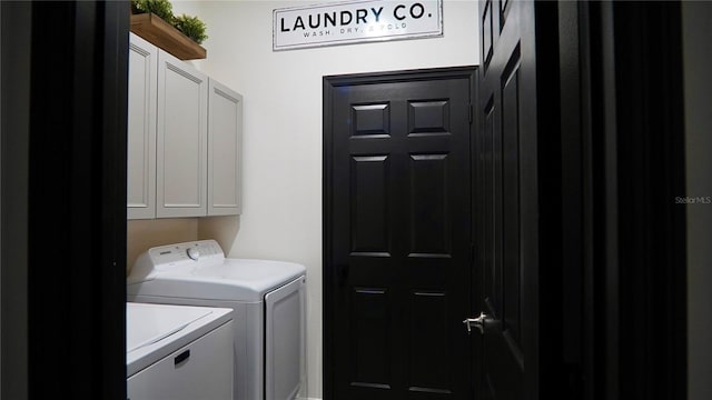 1025 Belvoir Dr, Kissimmee, FL 34744 - washroom featuring cabinet space and washer and clothes dryer