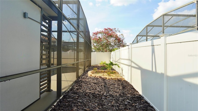 1025 Belvoir Dr, Kissimmee, FL 34744 - fenced backyard featuring a lanai
