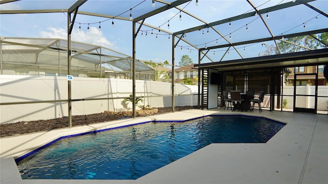 1025 Belvoir Dr, Kissimmee, FL 34744 - view of swimming pool featuring a patio area and a lanai