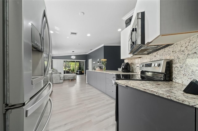 12041 Kajetan Ln, Orlando, FL 32827 - kitchen featuring stainless steel appliances, ornamental molding, backsplash, light wood-style flooring, and gray cabinetry