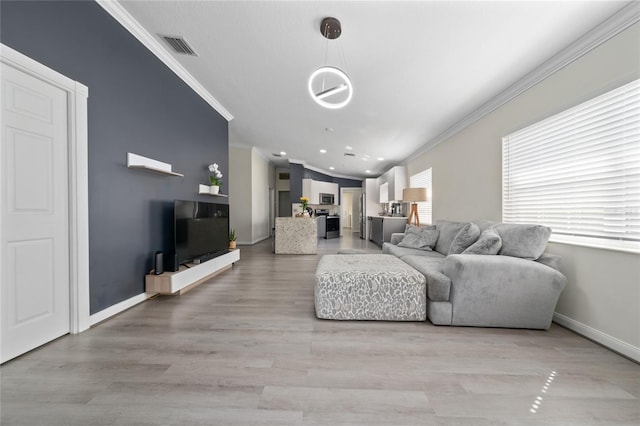 12041 Kajetan Ln, Orlando, FL 32827 - living room with ornamental molding, baseboards, light wood-style flooring, and recessed lighting