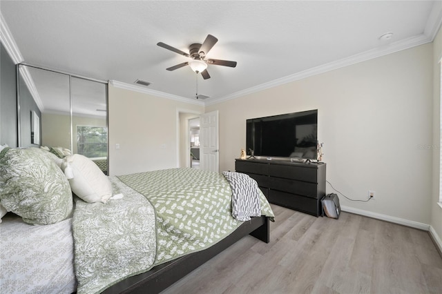 12041 Kajetan Ln, Orlando, FL 32827 - bedroom with wood finished floors, a closet, ornamental molding, ceiling fan, and baseboards