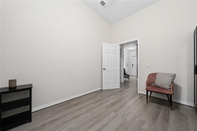 12041 Kajetan Ln, Orlando, FL 32827 - sitting room featuring wood finished floors, high vaulted ceiling, and baseboards