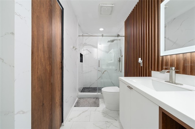 12041 Kajetan Ln, Orlando, FL 32827 - bathroom with marble finish flooring, toilet, a marble finish shower, and vanity