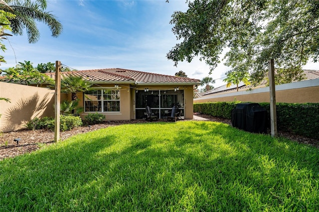 12041 Kajetan Ln, Orlando, FL 32827 - rear view of property featuring stucco siding, a tile roof, and a sunroom