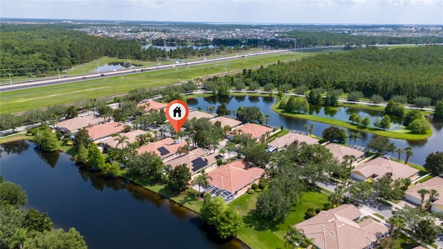 12041 Kajetan Ln, Orlando, FL 32827 - aerial view of property's location with nearby suburban area, a nearby body of water, and a heavily wooded area