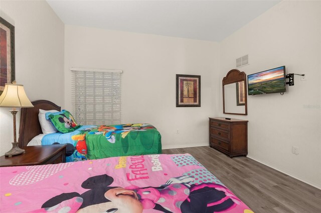 9055 Treasure Trove Ln Unit 409, Kissimmee, FL 34747 - bedroom with wood finished floors and baseboards