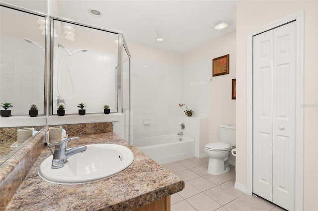 9055 Treasure Trove Ln Unit 409, Kissimmee, FL 34747 - bathroom with a closet, toilet, vanity, and tile patterned flooring