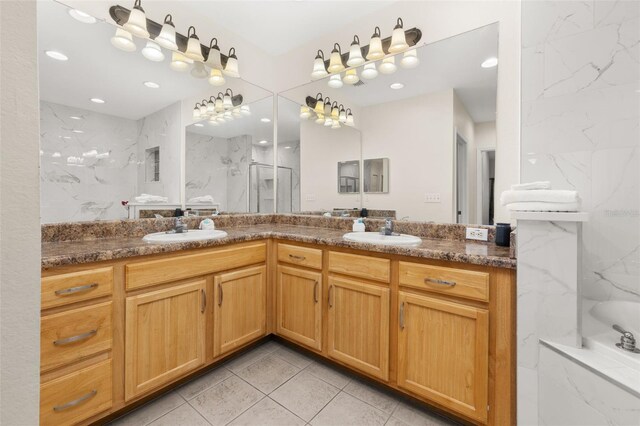 9055 Treasure Trove Ln Unit 409, Kissimmee, FL 34747 - full bath featuring double vanity, a marble finish shower, tile patterned floors, a tub with marble appearance, and recessed lighting