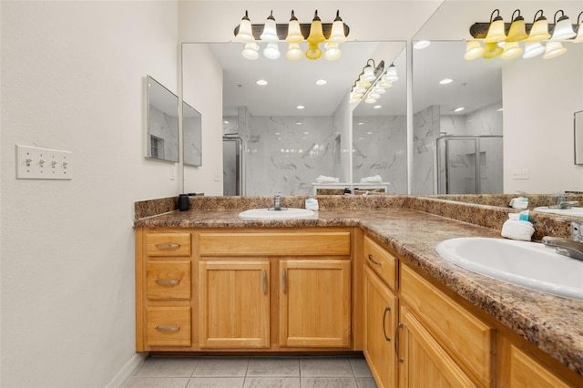 9055 Treasure Trove Ln Unit 409, Kissimmee, FL 34747 - full bath with a marble finish shower, double vanity, tile patterned flooring, baseboards, and recessed lighting